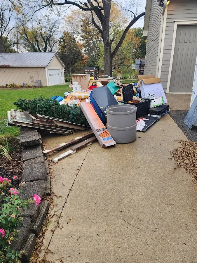 Dumpster being loaded with debris for 3 Yard Dumpster Rental in Owings Mills